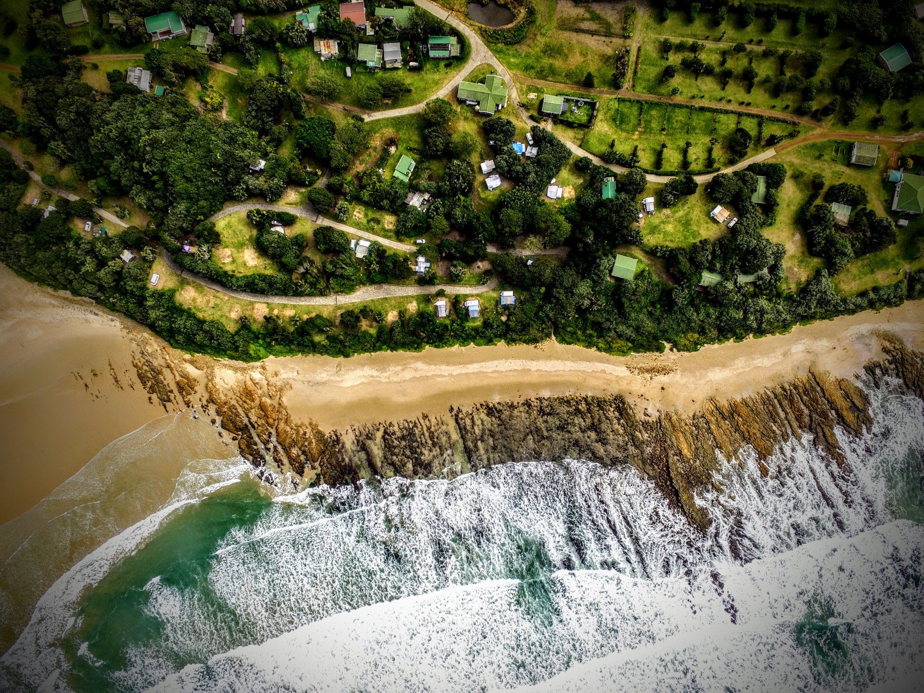 Yellow Sands campsites lining the beach at the Kwelera River mouth